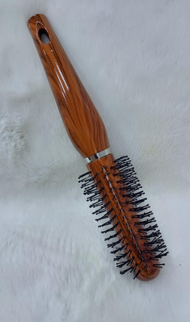 Woman Hand with Round Hair Brush on White Background – Perfect Styling Companion