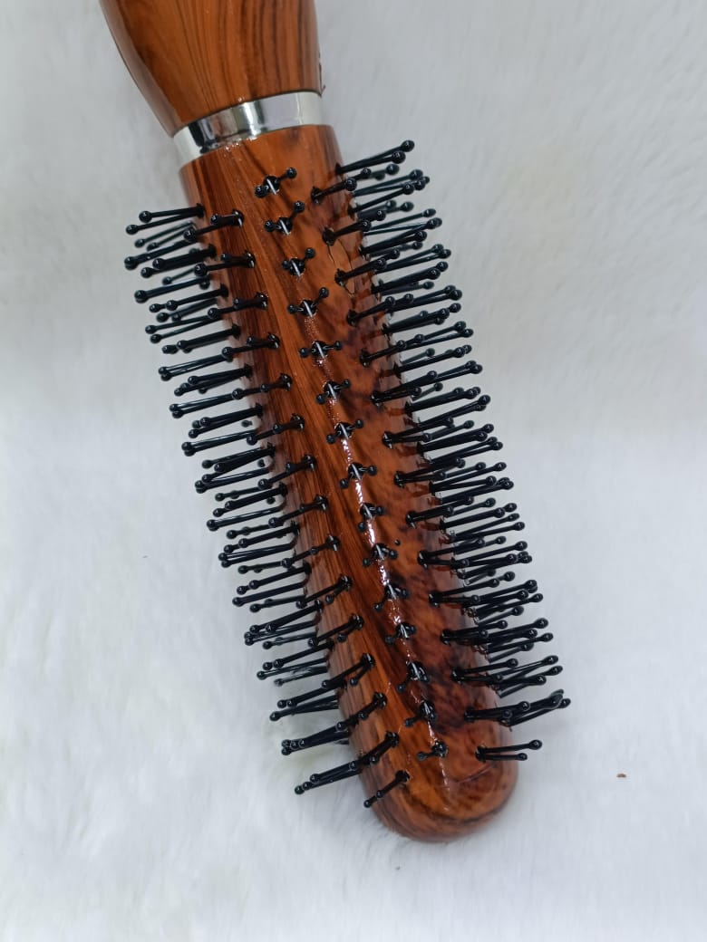 Woman Hand with Round Hair Brush on White Background – Perfect Styling Companion