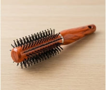 Woman Hand with Round Hair Brush on White Background – Perfect Styling Companion